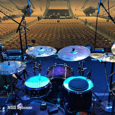 Drum kit on a stage facing an empty auditorium