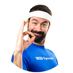 Smiling man in a white headband and blue NSD Spinner shirt giving an okay sign