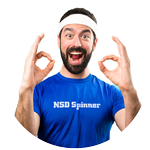 Excited man in a white headband and blue NSD Spinner shirt making okay signs with both hands