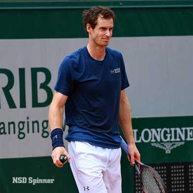 Tennis player holding an NSD Spinner in his right hand