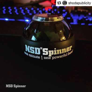 NSD Spinner glowing in front of a backlit keyboard