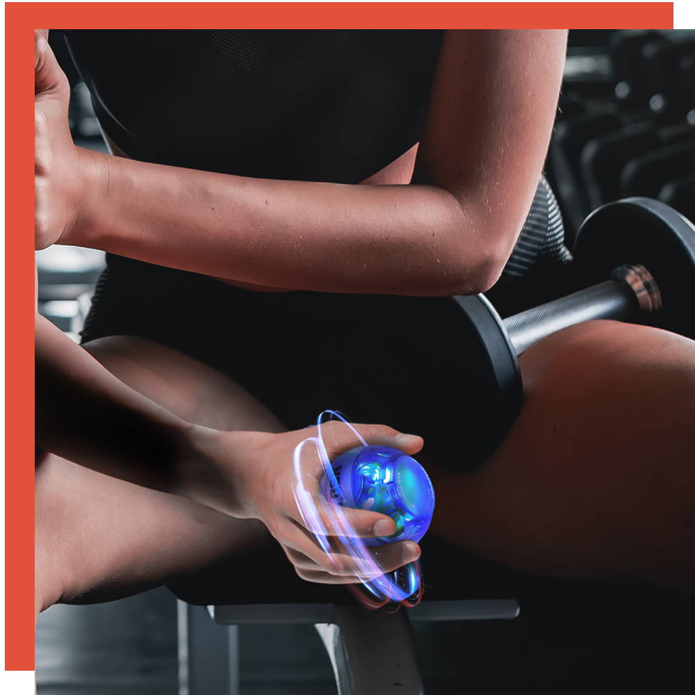 Woman exercising her wrist with an NSD Spinner at the gym